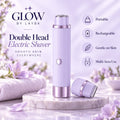 A lavender and silver double-head electric shaver by GLOW BY LAYBA is displayed on a marble pedestal with a matching cap beside it. The background is a soft, dreamy lavender scene with flowers, a towel, and promotional text highlighting features like portability, rechargeability, gentle on skin, and multi-area use.