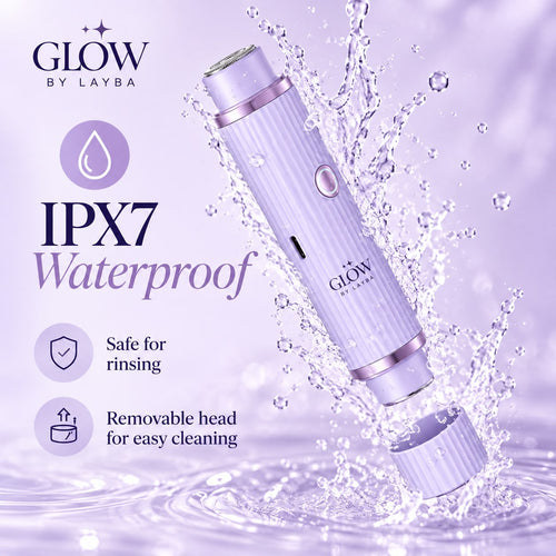 A purple and silver Glow by Layba beauty device shown with water splashes and text highlighting IPX7 waterproofing, safe rinsing, and a removable head.